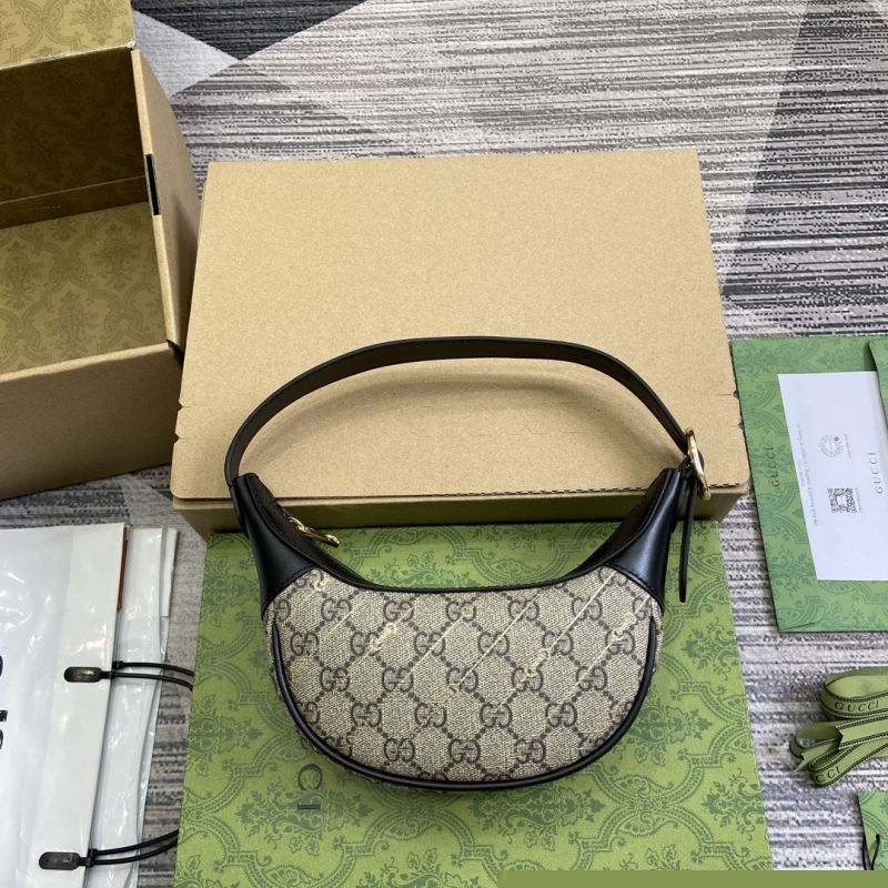 G*u*i top handle bags